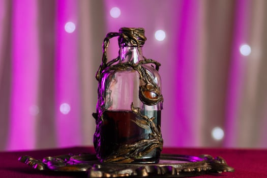 Magic vial with a glowing potion inside photo