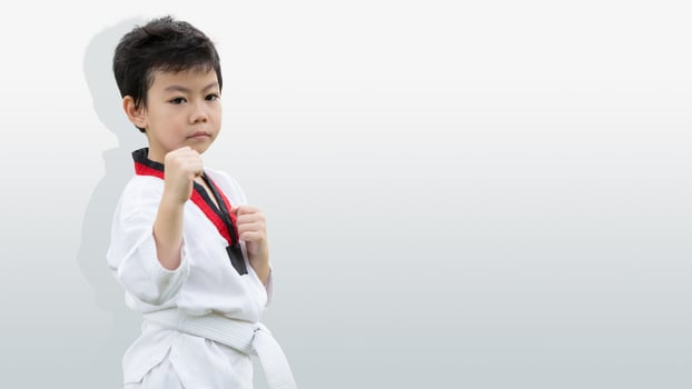 Taekwondo kid kick boxing, Boy fighter fighting stand isolated with white space for text photo