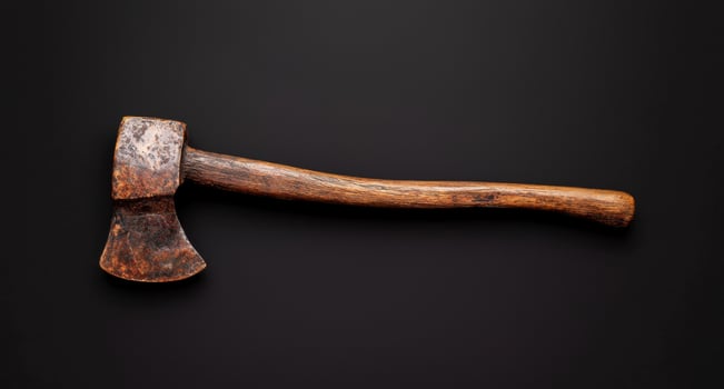 Vintage rustic axe on black background photo