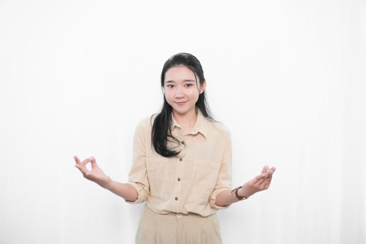 Expression of an Indonesian Asian model woman in white is meditating photo