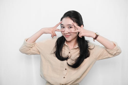 Expression of Indonesian Asian model woman in white dress smiling and beautiful photo
