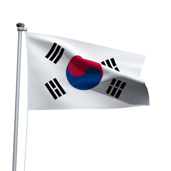 South Korea flag on a pole waving isolated on white background photo