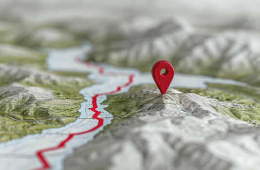 red map pin on topographic map photo
