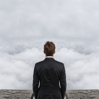 businessman looking out over clouds photo