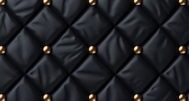 black leather upholstery texture with golden studs photo