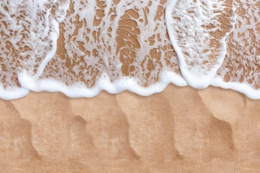 Waves crashing on sandy beach photo