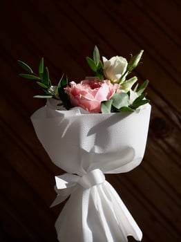 A bouquet of flowers tied with white ribbon photo