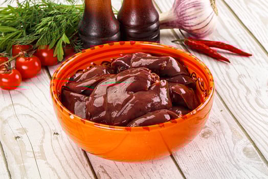 Raw chicken liver uncooked in the bowl photo
