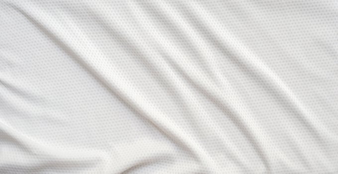 White sports clothing fabric football shirt jersey texture abstract background photo