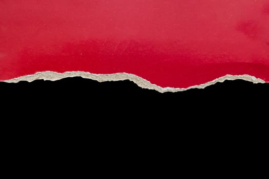 Red ripped paper torn edges strips isolated on black background photo