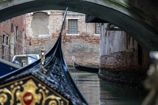 Gondola ride with the view of canal in venice, italy. photo