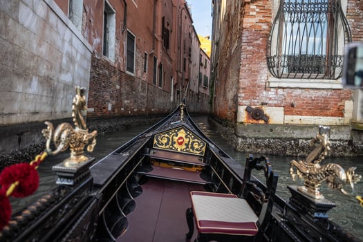 Gondola ride with the view of canal in venice, italy. photo