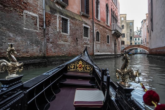 Gondola ride with the view of canal in venice, italy. photo