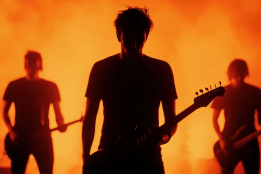 Silhouetted musicians perform passionately against a fiery backdrop. photo