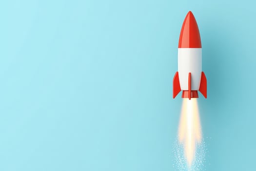 A colorful rocket launching into the sky on a clear blue background, symbolizing innovation. photo