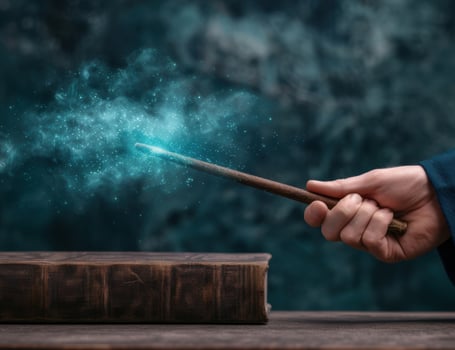 Magical wand casting spell on old book photo