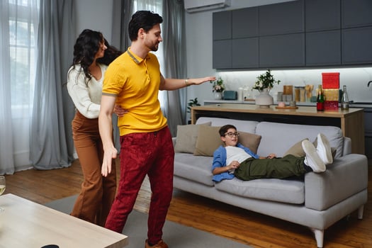 Family enjoying a playful moment in a cozy living room in the afternoon photo