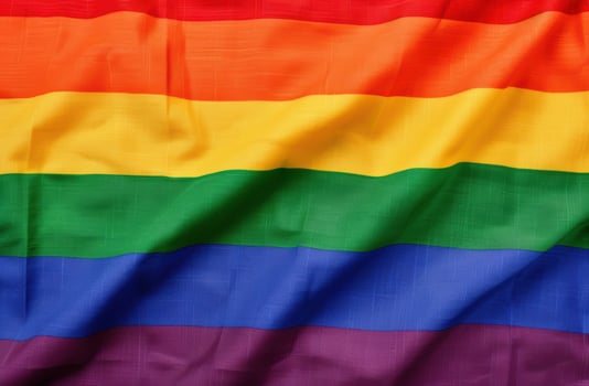 Colorful pride flag waving in the wind photo