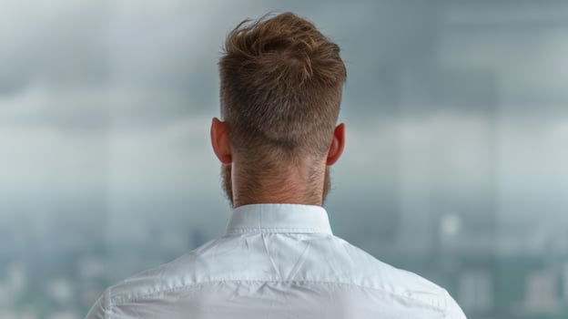 Back view of a man with short brown hair photo