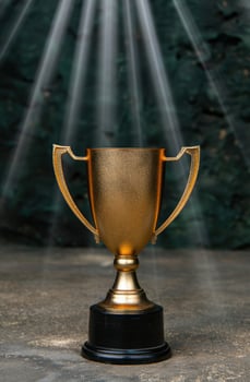 golden trophy against blurred nature background photo