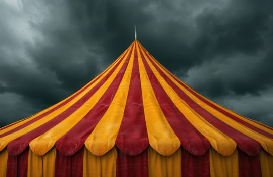 Dramatic circus tent against stormy sky photo