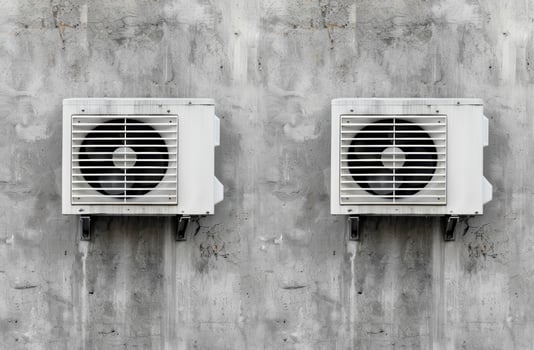 air conditioning units on concrete wall photo