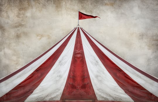 Dramatic circus tent with red and white striped fabric photo