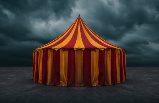 Dramatic circus tent against stormy sky photo