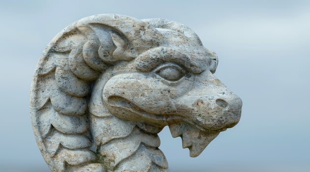 Weathered stone dragon sculpture photo