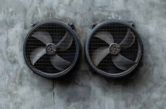 Pair of industrial fans on a grunge background photo