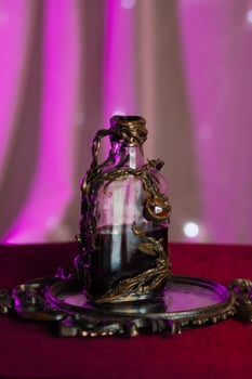 Magic vial with a glowing potion inside photo