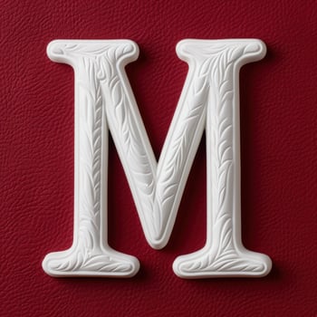 Decorative white letter M on red background photo