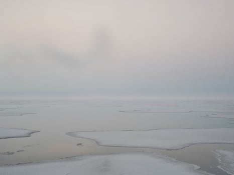 Vast Salt Flats Covered in Haze and Reflection. photo