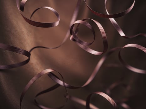 Chocolate curl ribbons on dark background. photo