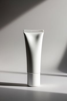 a simple and sleek cosmetic tube in matte white. photo