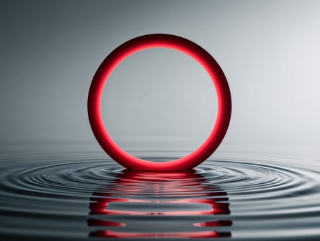 A glowing red circle is floating on the surface of a body of water. photo