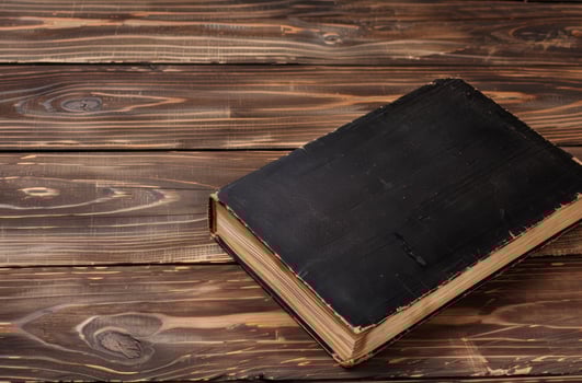 old book on wooden table photo