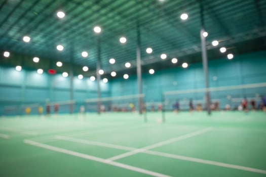 Blur badminton indoor sport game court for background photo