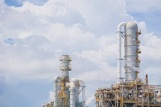 Petrochemical Petroleum Refinery Oil and Gas plant industrial complex building with Atmospheric distillation tower landscape summer blue sky. photo