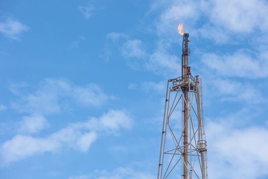Methane Gas Fire High Flare Stack Flaring Tower Platform in Refinery Petroleum Plant or Flame Burn On Offshore Oil Extraction Process. photo