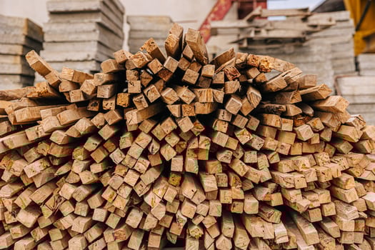 Wood stick pile stacked used in construction site for concrete precast support. photo