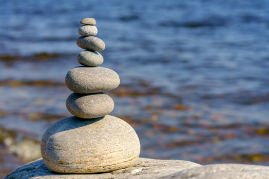 Pyramid of stones. Unstable balance of stone objects. Idyllic state of nature. photo