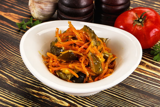 Salad with korean carrot and cucumber photo