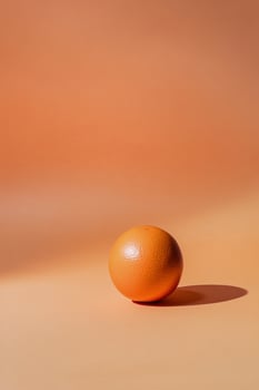 Bright yellow background highlights a simple white bowl and palm leaf shadows photo