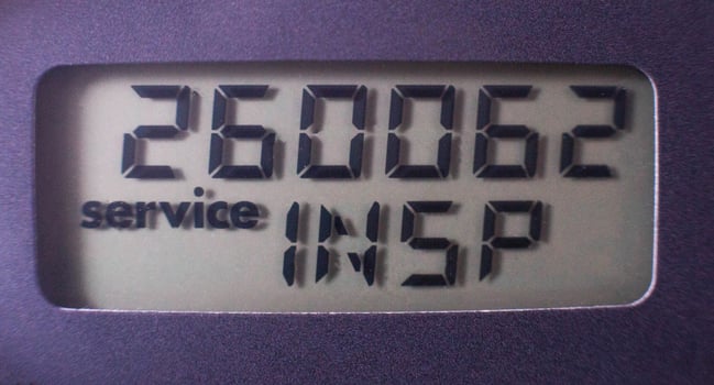 vehicle maintenance interval on display, vehicle mileage, close-up photo