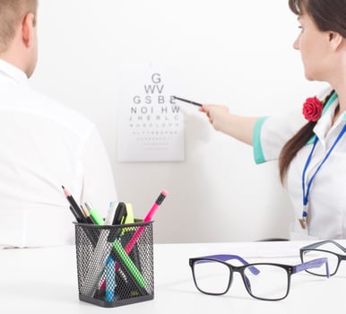 A patient is taken by an ophthalmologist who checks visual acuity. Ophthalmic diseases concept cataract and glaucoma, background photo