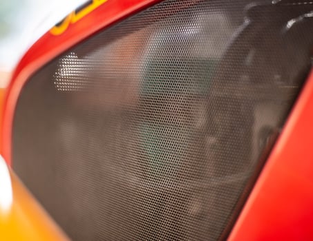 Protective net engine compartment in the car, an element of tuning. Background, copy space, mesh photo