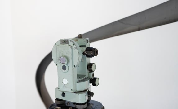 Theodolite device is a measuring device for determining horizontal and vertical angles in topographic surveys, geodetic and surveying works, in construction, close-up photo