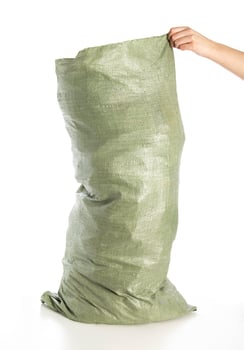 Full bag with construction debris in hand on a white background, isolate. Garbage photo