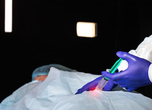 A neurosurgeon neurologist injects a medicine into a herniated disc to a patient who has pain and inflammation in the back. Pain relief for diseases of the spine with spinal block photo